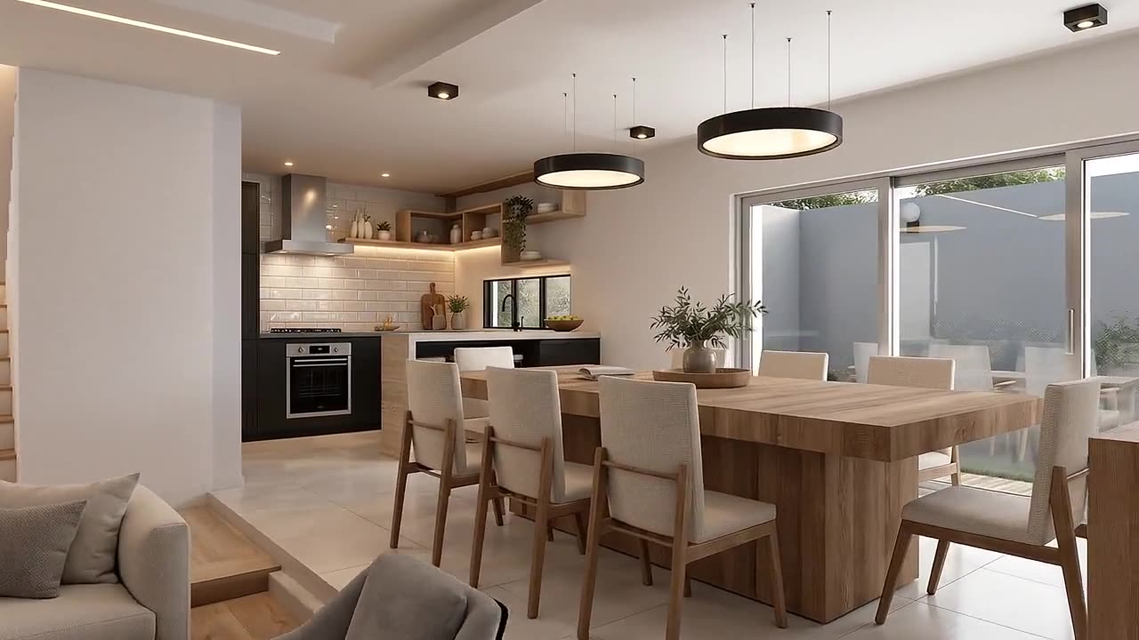Cocina y comedor con mesa de madera y lámparas circulares